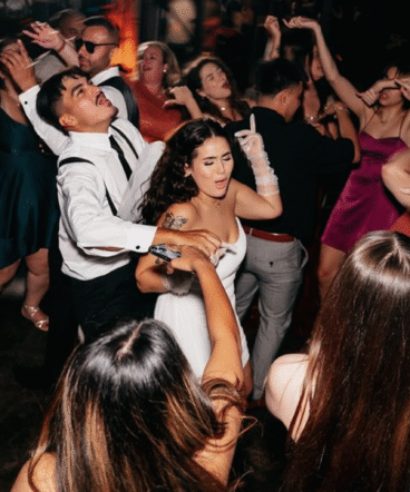 Lively Candid Reception Moment with Dance Floor Energy